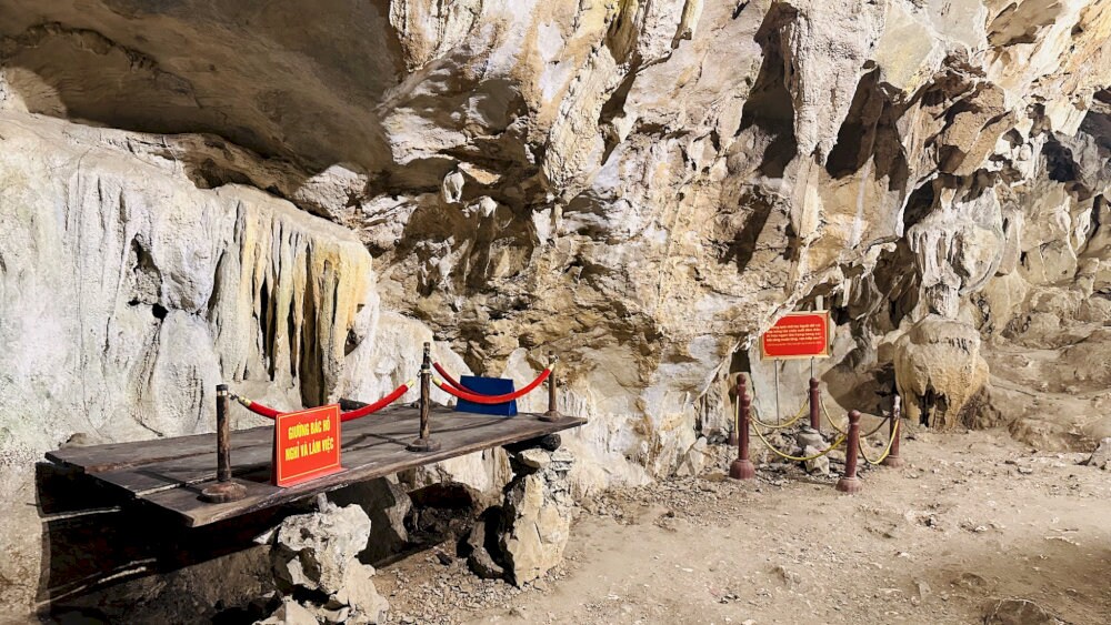 Inside the cave, historic items like Ho Chi Minh’s wooden bed and stone desk are carefully preserved